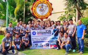 Group of people posing in front of the CIT University Sal